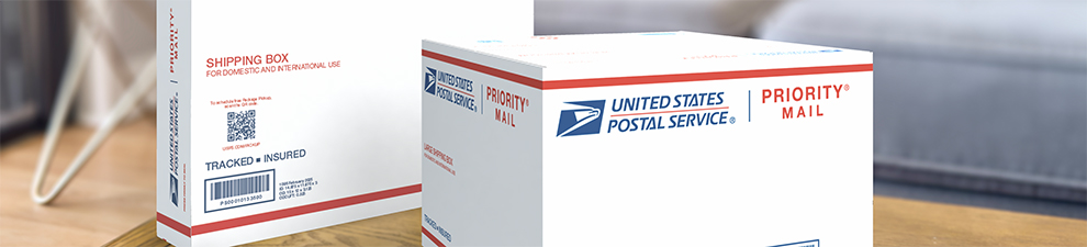 Two Priority Mail International® boxes sitting on a table.
